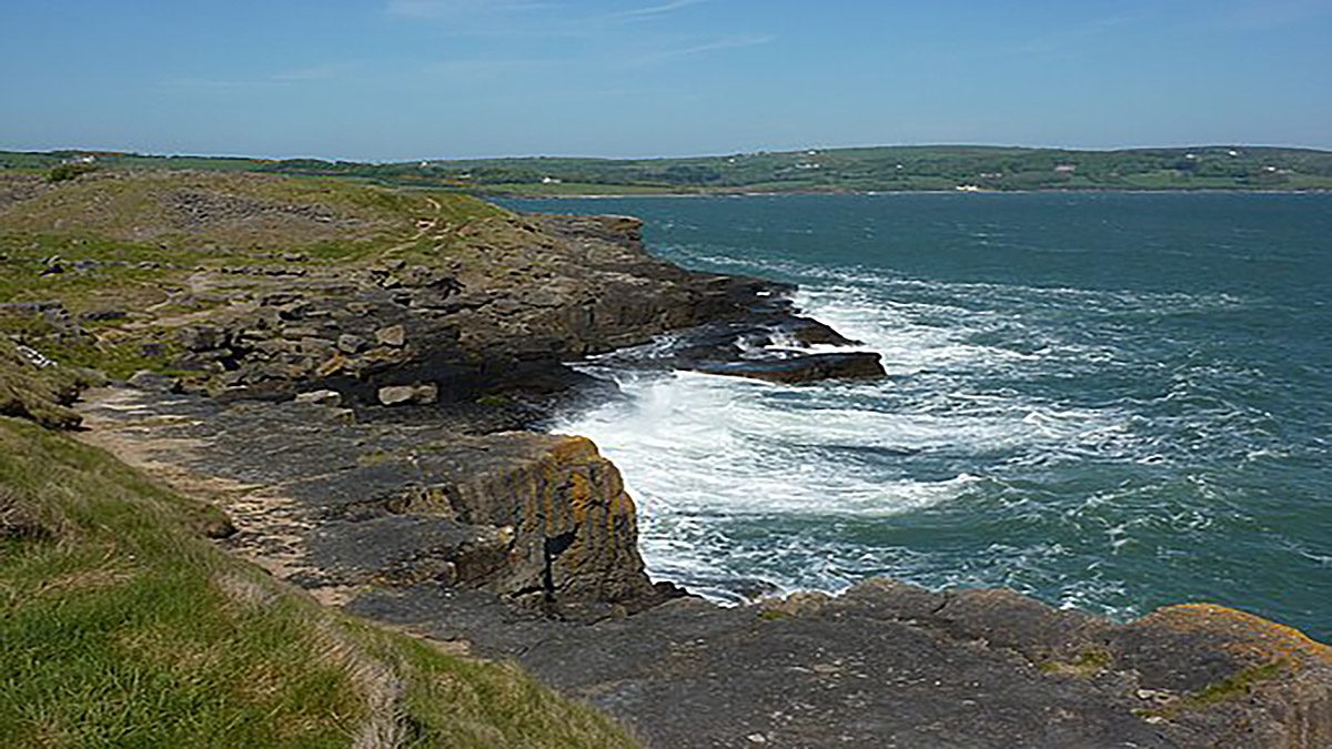 Isle of Anglesey - Rough seas and its beautiful beach from Wikimedia Commons by Peter Barr